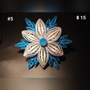 Hand quilled ornaments. They are made of only paper and Glue!